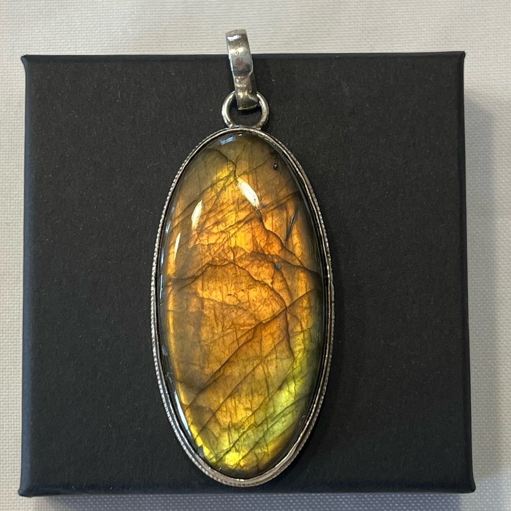 Sterling silver labrodite oval pendant
large. Bold statement piece!
